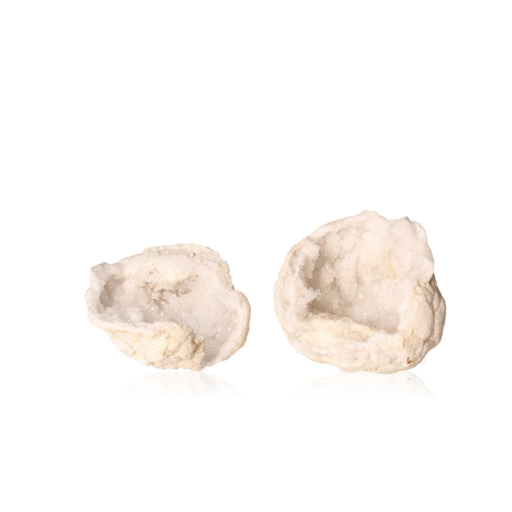 Milky quartz geodes displaying sparkling white crystals within an earthy shell, perfect for purifying energy and promoting clarity.