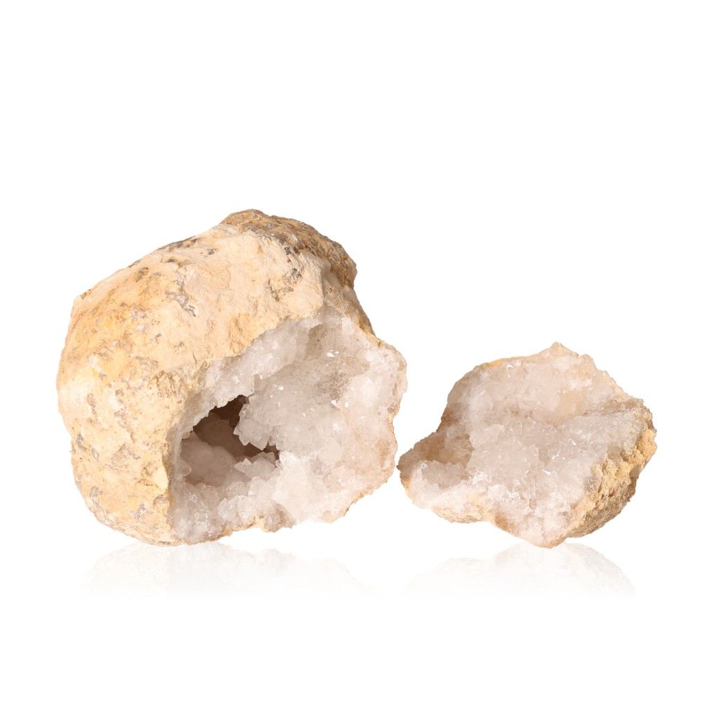 Milky quartz geode with rugged shell and sparkling white crystals, ideal for cleansing spaces and boosting focus with amplifying energy.