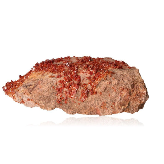 "Vanadinite Druze with vibrant reddish-brown hexagonal crystals and a glassy surface, enhancing focus and motivation."