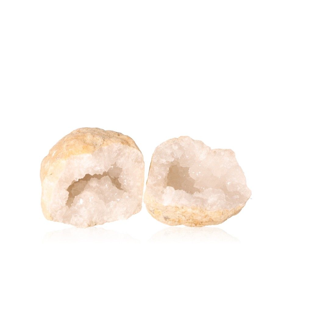 Milky quartz geode revealing sparkling cloudy white crystals, enhancing tranquility and clarity with purifying properties.