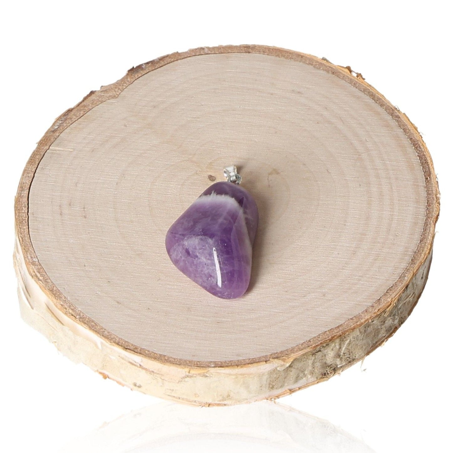 Amethyst Malawi tumbled pendant on wooden slab background.