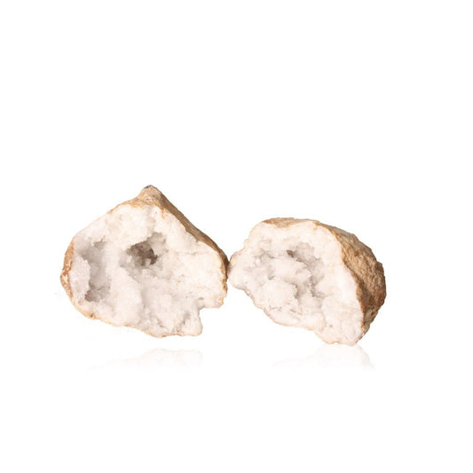 Quartz geode showing rugged shell and sparkling white crystals, known for purifying energy, enhancing tranquility, and promoting focus.