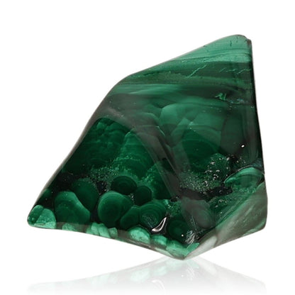 Polished malachite gemstone with rich green hues, symbolizing calming and energizing properties for courage and hope.