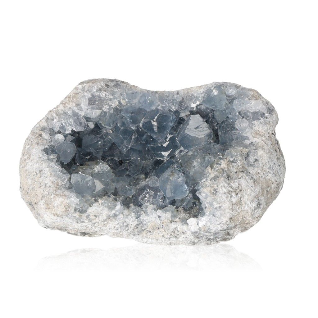 Raw celestite crystal geode showcasing calming blue hues and serene energy properties.