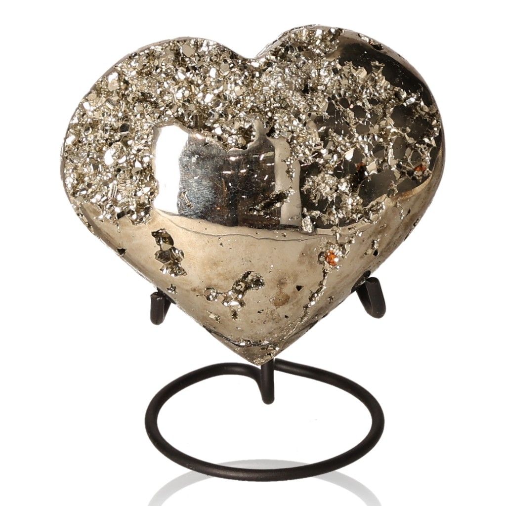 Pyrite heart-shaped stone on a stand, believed to boost independence and inspire ideas, courage, and goal achievement.