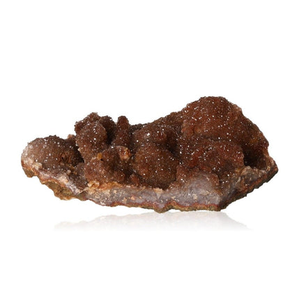 Raw brown mineral specimen with sparkling crystal formations on a white background.