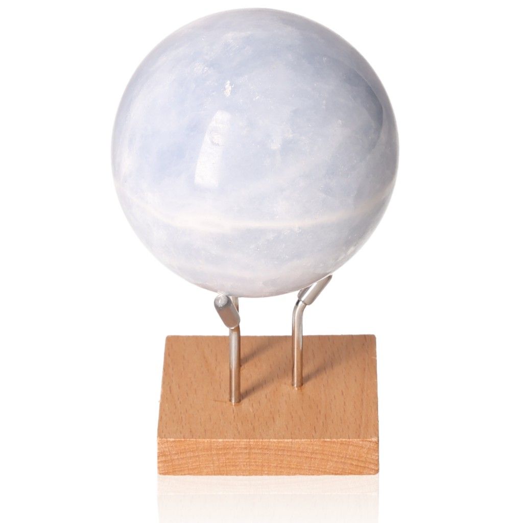 Blue Calcite Sphere on a wooden stand, known for stress relief, communication, and emotional healing with soft blue hues.