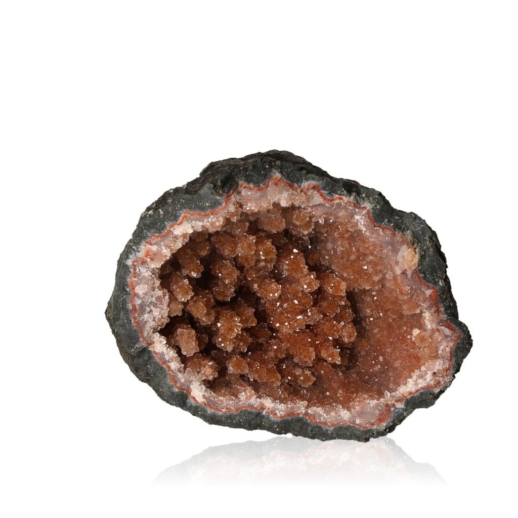 Brown geode with sparkling crystal interior on a white background.