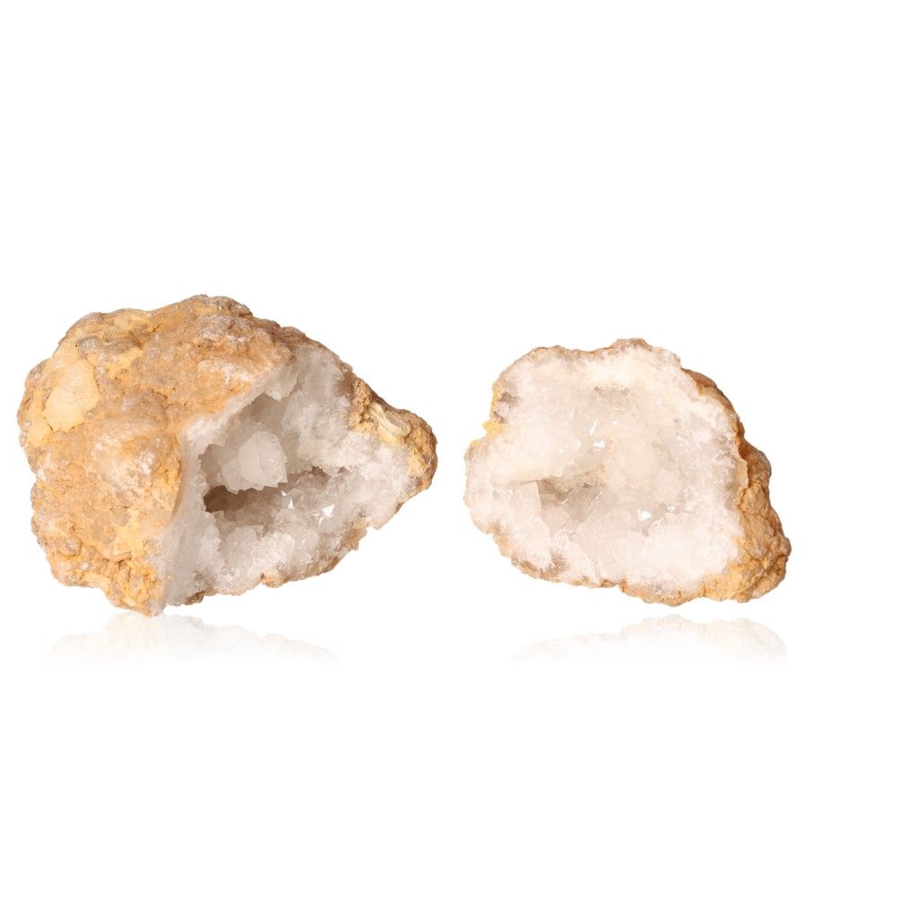 Milky quartz geodes with earthy shell and sparkling white crystals for energy balance and positive vibrations.