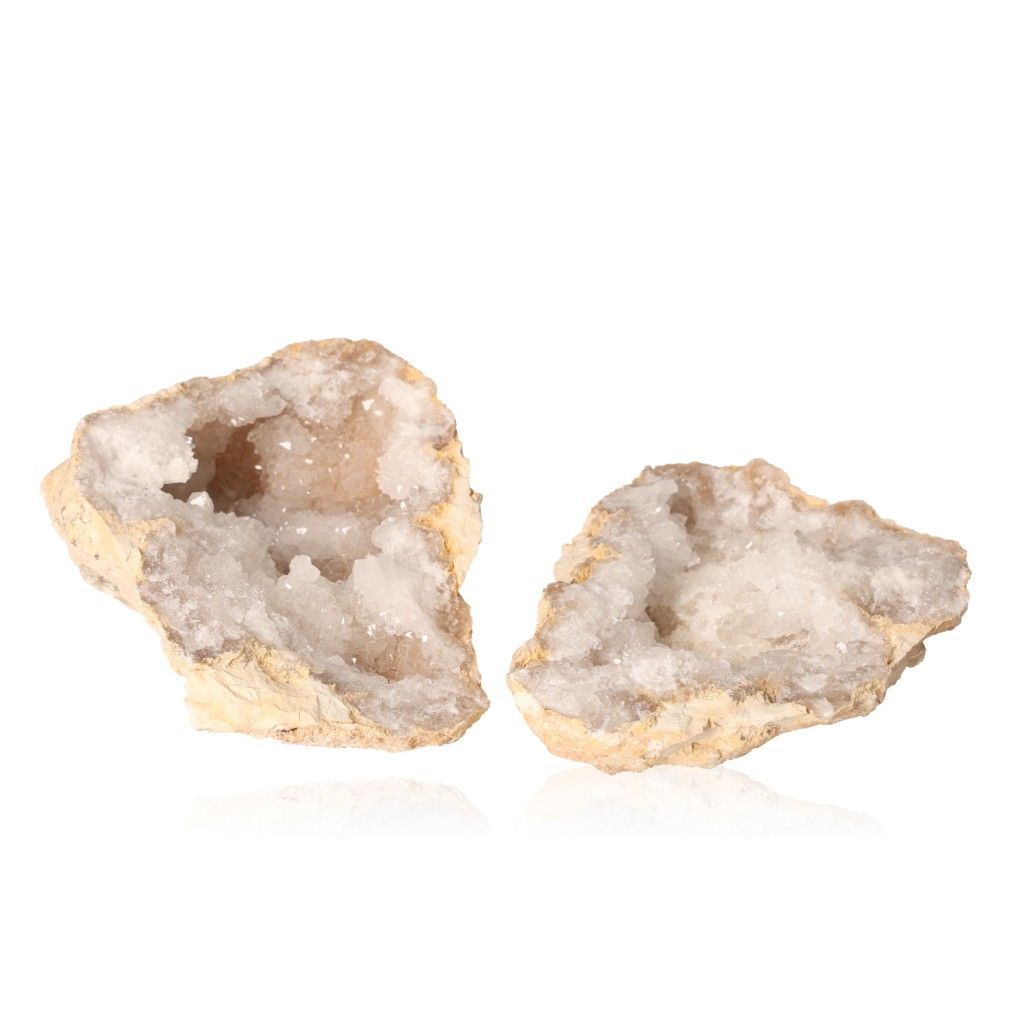 Milky quartz geode with sparkling white crystals on white background, perfect for enhancing tranquility and balancing energy.