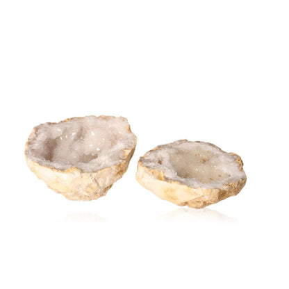 Milky quartz geodes, open to reveal sparkling cloudy white crystals, perfect for energy cleansing and enhancing tranquility.