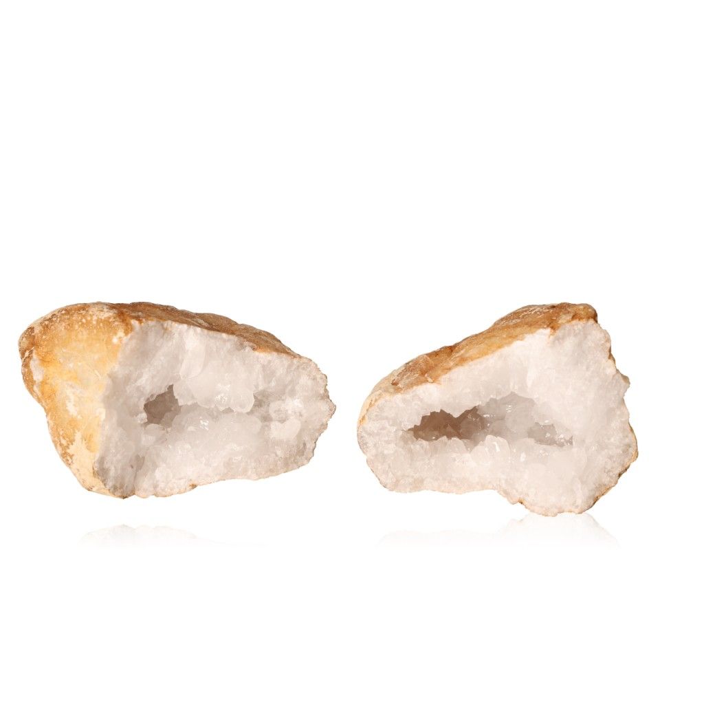 Milky quartz geode with rugged shell and sparkling white crystals displayed on a white background.