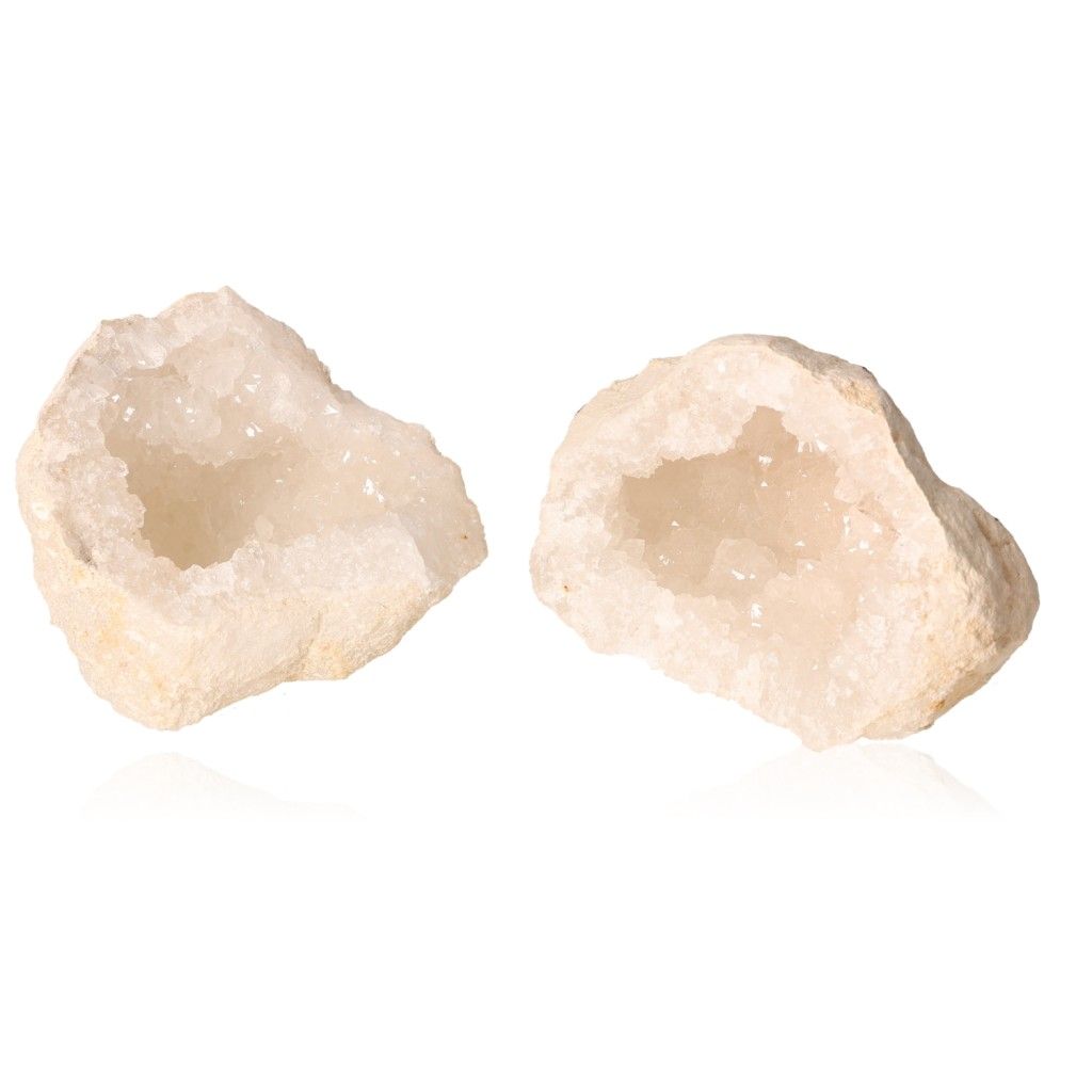 Milky quartz geodes with rugged shell and sparkling white crystals, known for purifying energy and enhancing tranquility.