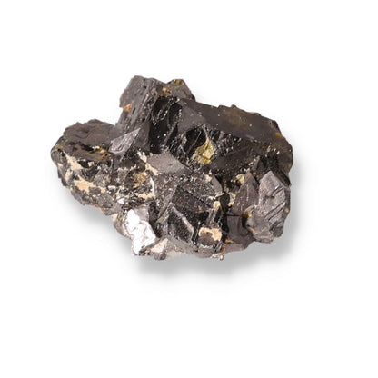 Sphalerite mineral specimen showcasing its dark, reflective surfaces used in jewelry and spiritual practices for grounding energy.