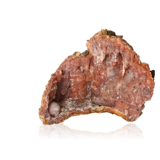 Calcite stalactite showcasing earthy tones and layered structure, symbolizing growth, energy, and natural beauty.