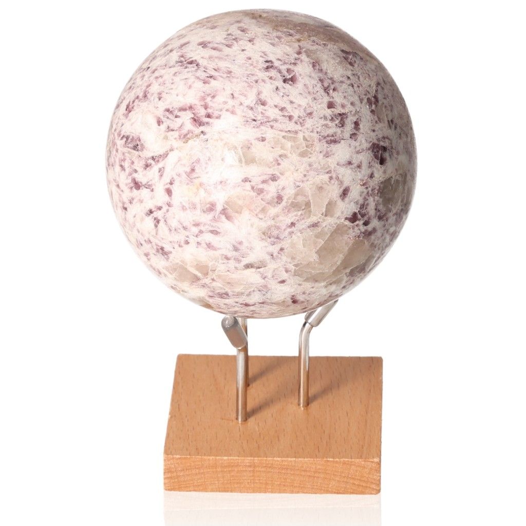 Lepidolite sphere on a wooden stand, a crystal for peace and emotional balance, reducing anxiety and promoting positivity.