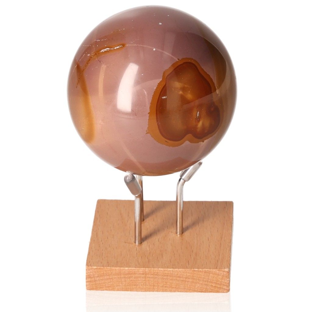 Polychrome Jasper Sphere with vibrant colors and unique patterns on a wooden stand for grounding and energizing properties.