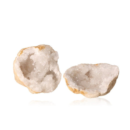 Milky quartz geode with rugged shell and sparkling white crystals, promotes tranquility and energy balance.