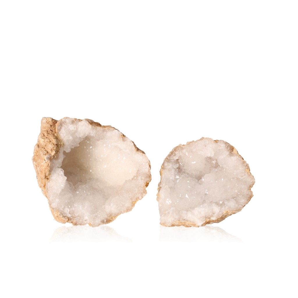 Milky quartz geode with sparkling white crystals, showcasing its rugged outer shell and enhancing tranquility and positive energy.