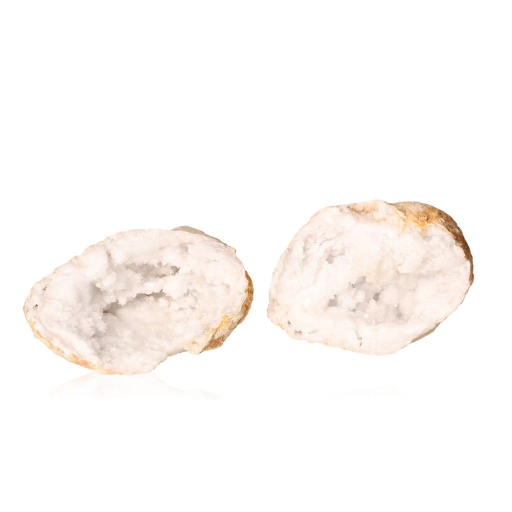 White quartz geode with rugged outer shell and sparkling crystals, known for purifying and amplifying energy, enhances tranquility and clarity.