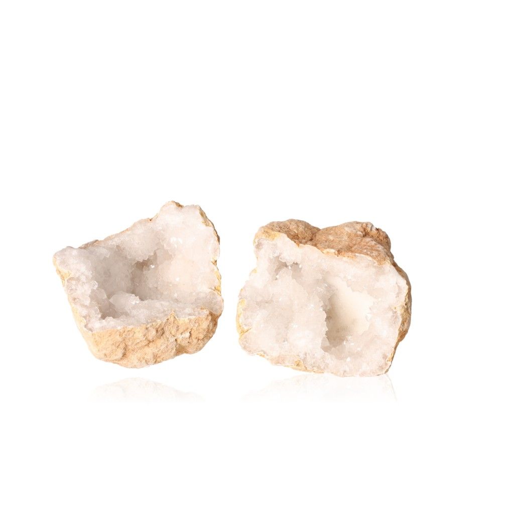 Milky quartz geode with sparkling white crystals and earthy shell, known for purifying energy and enhancing tranquility.