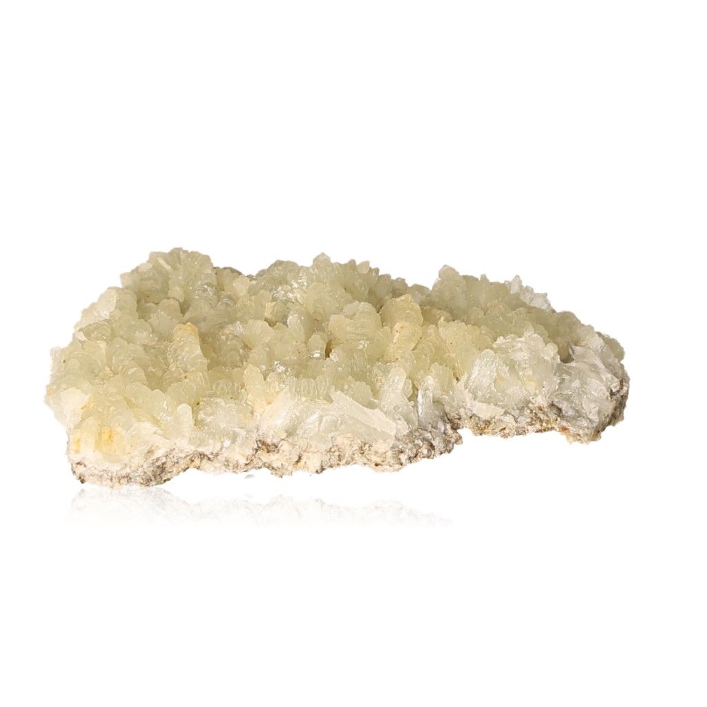 Prehnite druzy gemstone with pale green crystals has calming properties, promoting inner peace and spiritual growth.