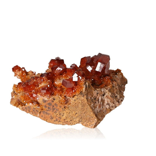 Vanadinite druze with vibrant reddish-brown hexagonal crystals on rocky surface, enhances focus and personal transformation.