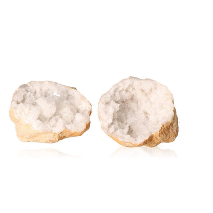 Milky quartz geode with rugged exterior and sparkling white crystals, known for purifying energy and enhancing tranquility.