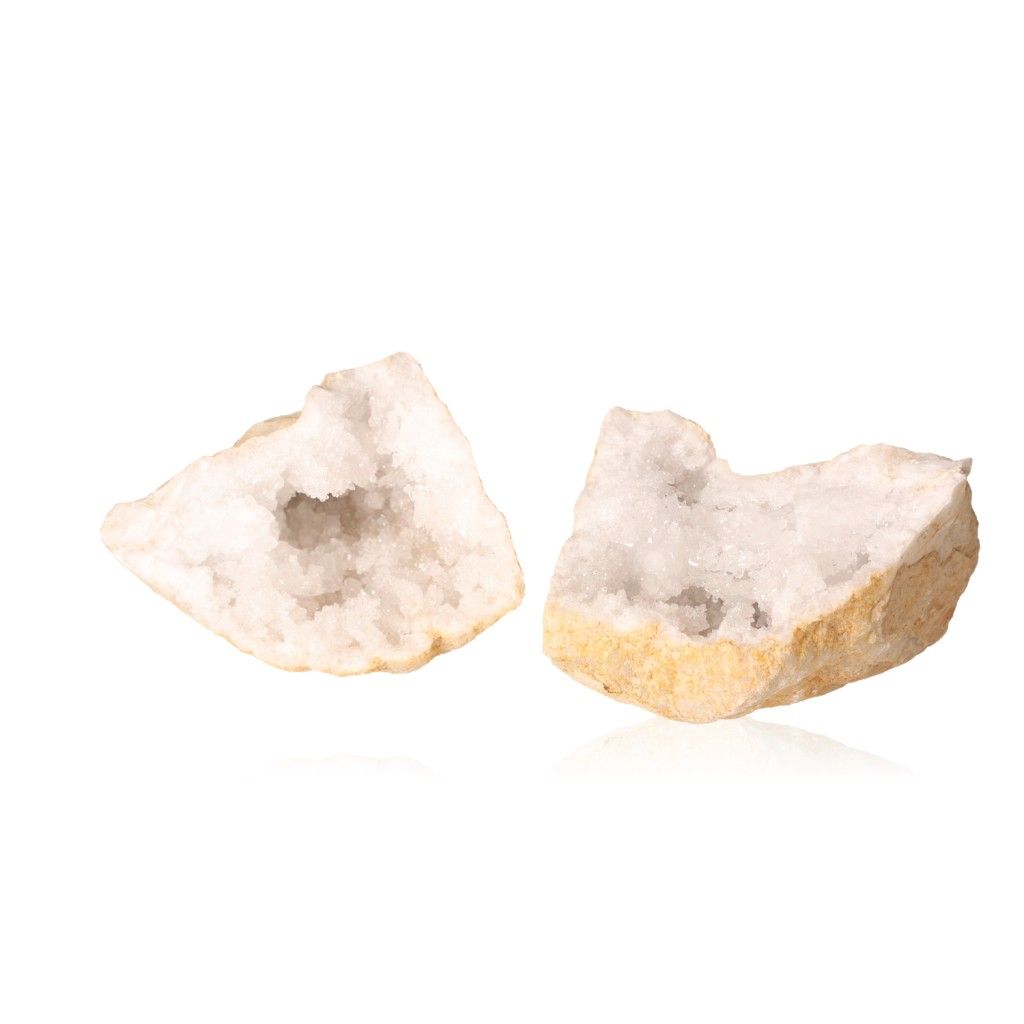 Opened milky quartz geode revealing sparkling, cloudy white crystals, known for purifying energy and enhancing tranquility.