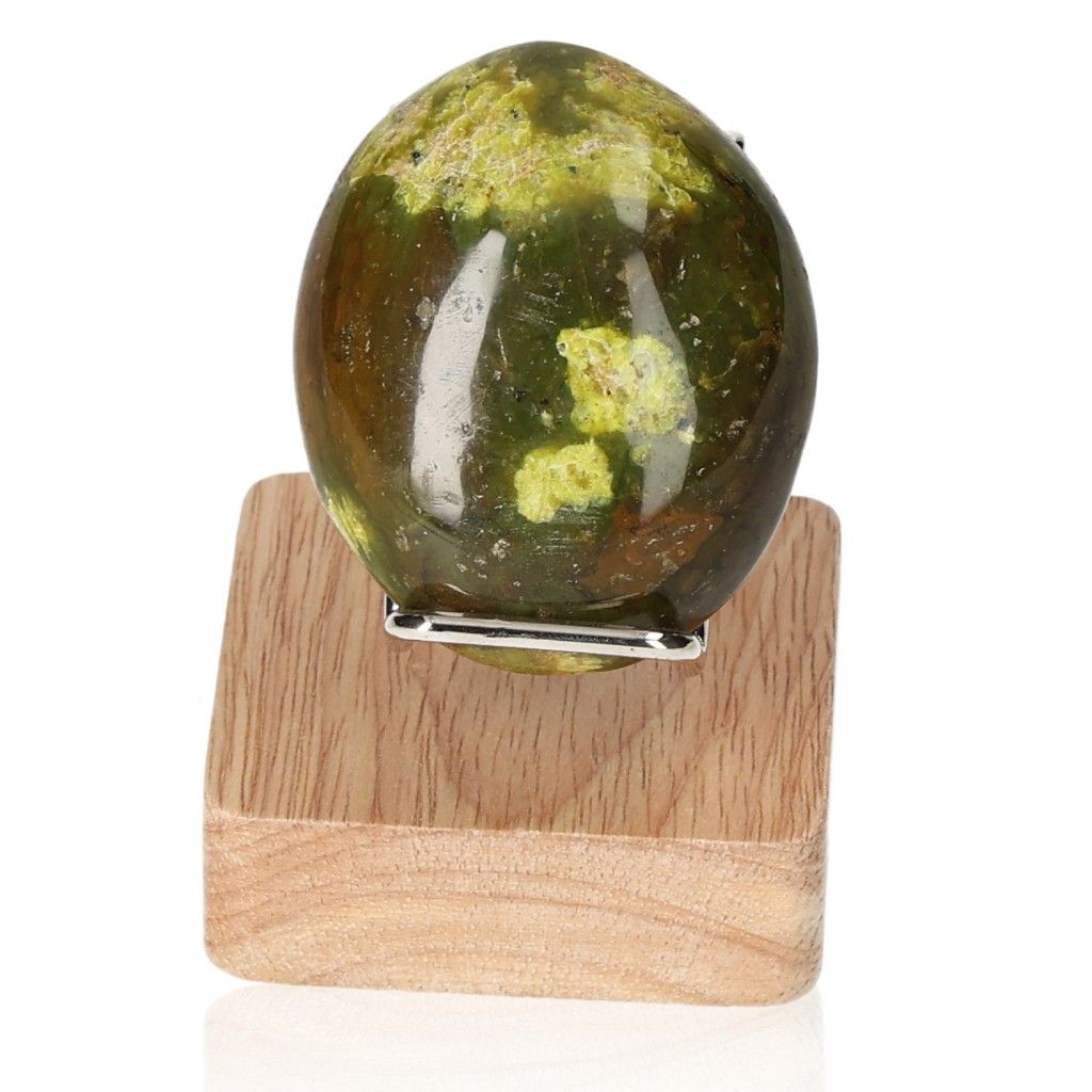 Green Opal Freeform on wooden stand, showcasing its healing and renewal properties with soothing green hues.