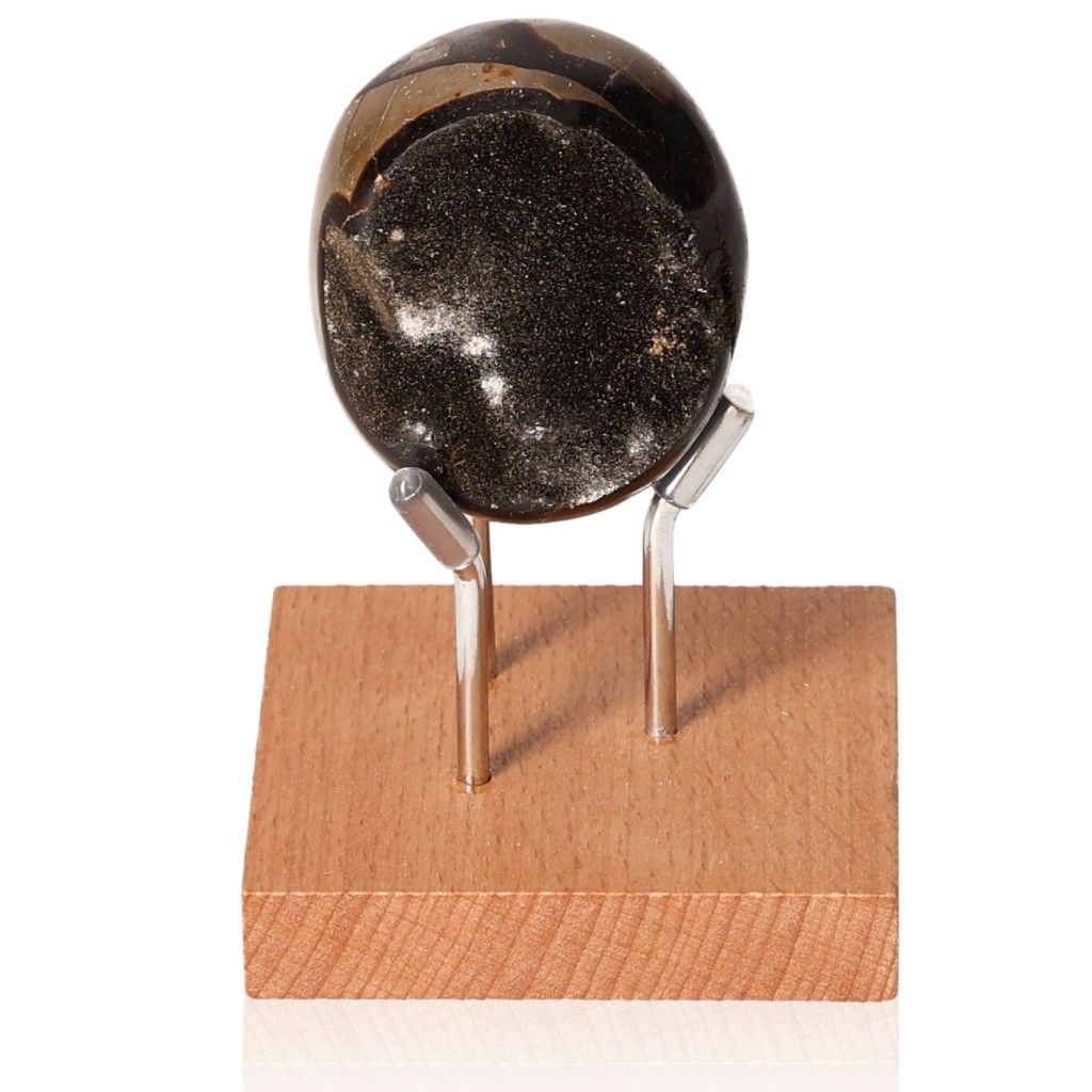 Unique Septarian "Dragon Stone" on wooden stand, showcasing its multidimensional properties and powerful symbolism.