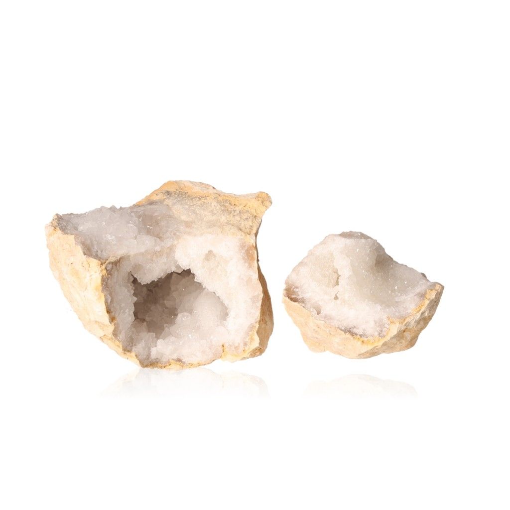 Milky quartz geode split open, revealing sparkling white crystals inside, perfect for enhancing tranquility and balancing energy.