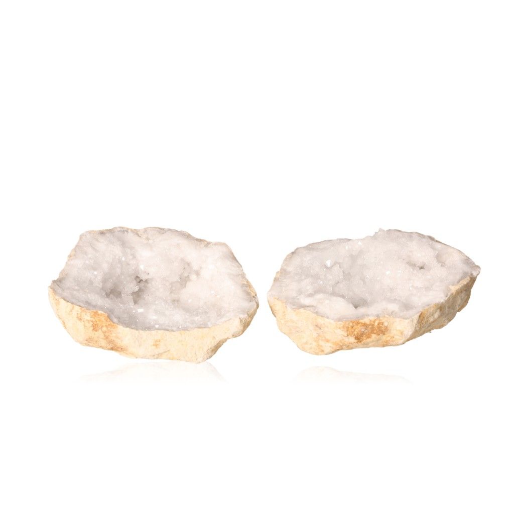 Open milky quartz geode revealing sparkling white crystals with an earthy outer shell, promoting tranquility and positive energy.