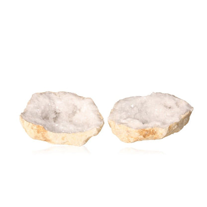 Open milky quartz geode revealing sparkling white crystals with an earthy outer shell, promoting tranquility and positive energy.