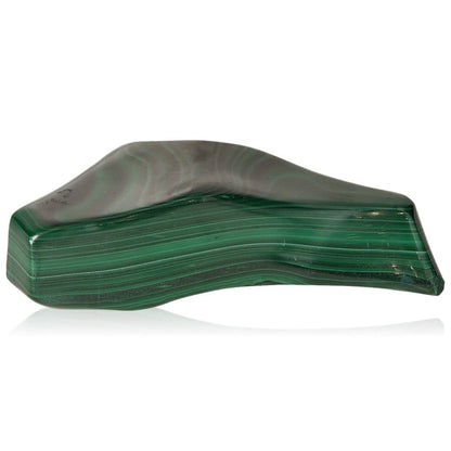 Polished malachite stone with soothing green striations promoting courage and harmony.