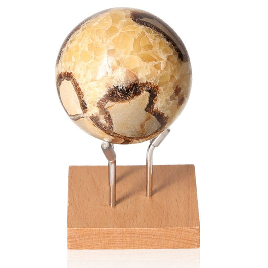 Septarian sphere on wooden stand, showcasing unique patterns and rich symbolism of the Dragon Stone.