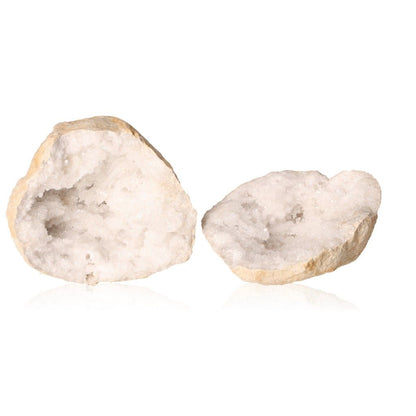 Milky quartz geode split open showcasing sparkling white crystals, known for amplifying energy and promoting tranquility and clarity.