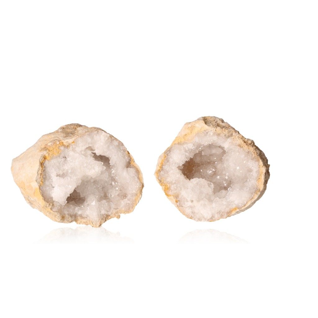 Milky quartz geode split open, revealing sparkling white crystals, promoting tranquility and clarity. Ideal for energy balance and positive vibes.