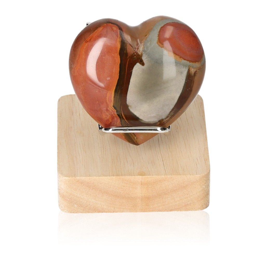 Polychrome Jasper Heart on wooden stand showcasing vibrant red and brown colors with unique banded patterns.