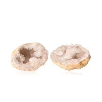 Milky quartz geodes with sparkling white crystals for energy purification and clarity enhancement.