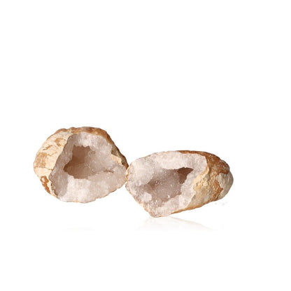 Milky quartz geode with rugged shell revealing sparkling white crystals, known for purifying energy and promoting tranquility.