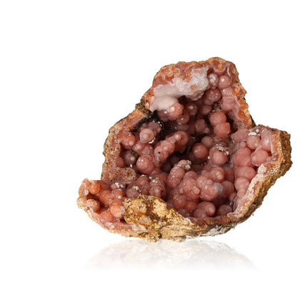 Pink calcite stalactite with layered structures showcasing natural beauty and grounding energy.