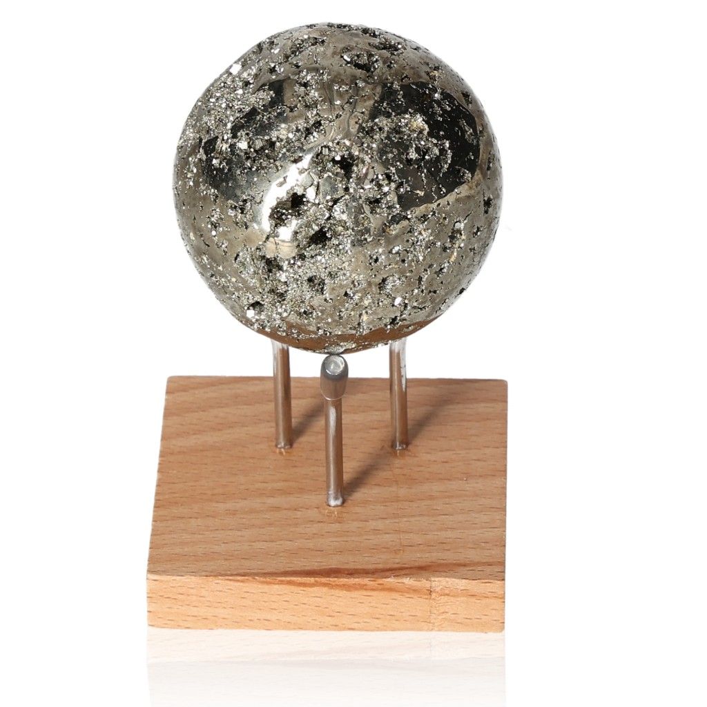 Pyrite sphere on wooden stand, promoting independence and courage, ideal for boosting creativity and motivation in daily life.