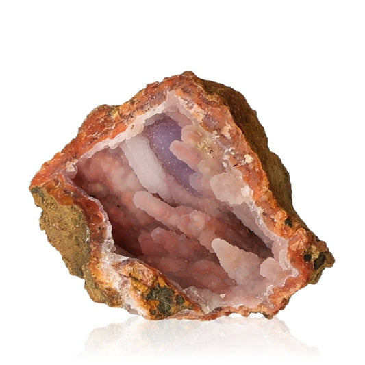 Calcite stalactite showcasing earthy tones and intricate layers, symbolizing growth and grounding energy in a natural cave formation.