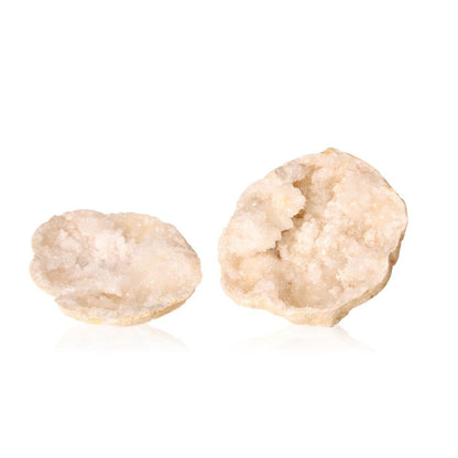 Milky quartz geodes with sparkling white crystals, known for purifying energy and enhancing tranquility.