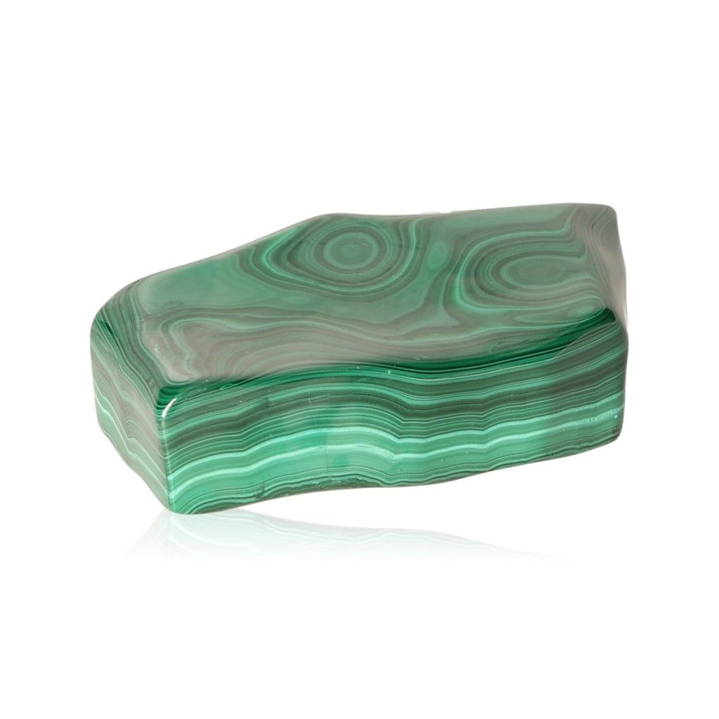 Polished malachite stone with swirling green patterns, symbolizing nature's soothing energy and promoting inner harmony and optimism.