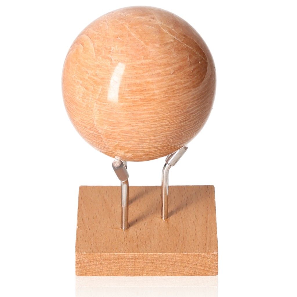 Peach Moonstone Sphere on stand, promoting calm and emotional healing with its soft peach hue and nurturing energy.