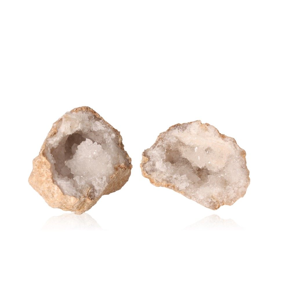 Milky quartz geodes with cloudy white crystals, showcasing rugged outer shells and sparkling interiors for energy cleansing and focus.