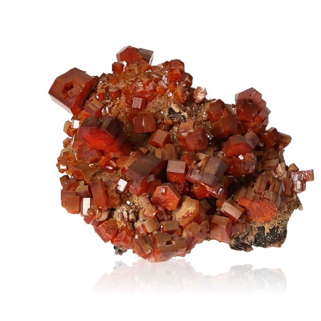 Vanadinite Druze with vibrant reddish-brown hexagonal crystals on a glassy surface, enhancing focus and motivation.