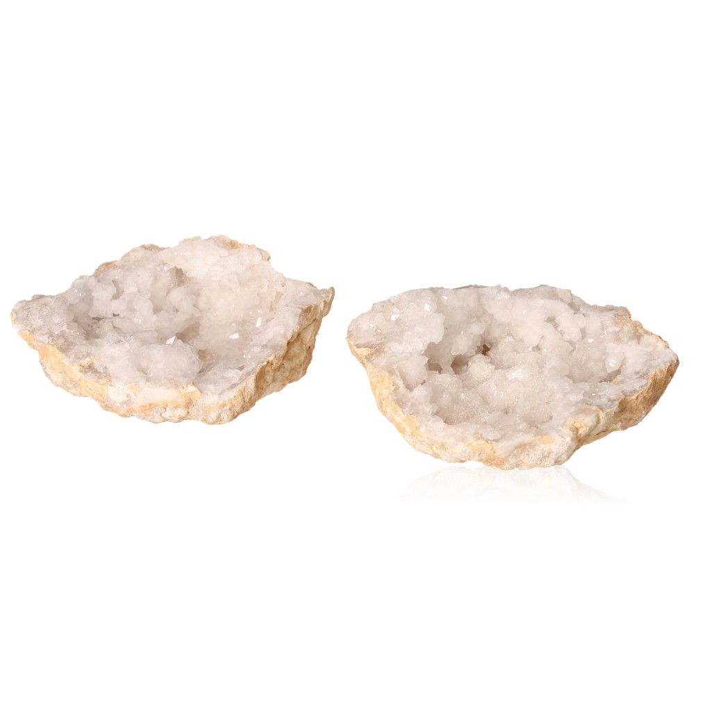 Milky quartz geodes with rugged shell and sparkling cloudy white crystals, ideal for balancing energy and enhancing tranquility.